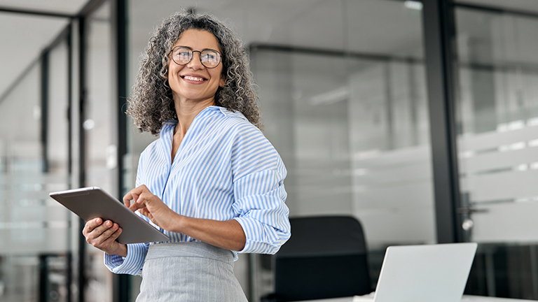 Image of smiling older female professional worker