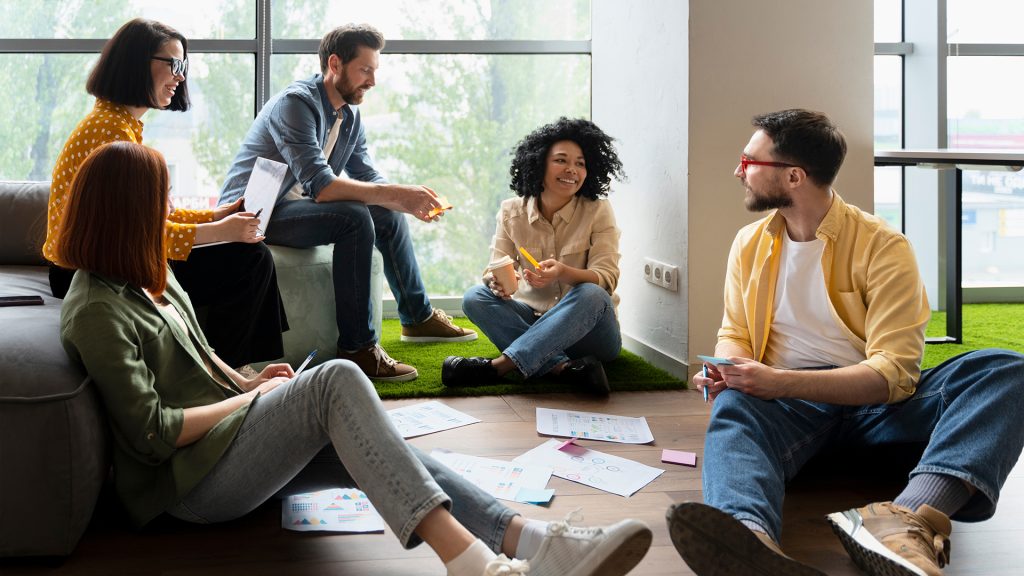Diverse group of university graduate student working on new project together in the library campus